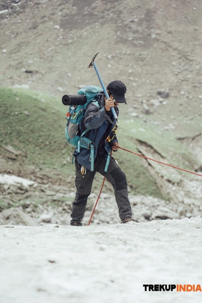 Trek leader making route to decend saflyTrekkers Repling Buran Ghati Pass Trek Trekup India